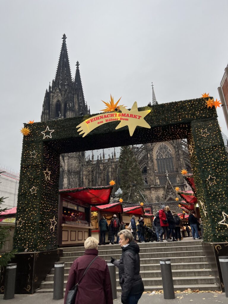 Entrance to the Cologne Cathedral Christmas Market with Cologne Cathedral behind it