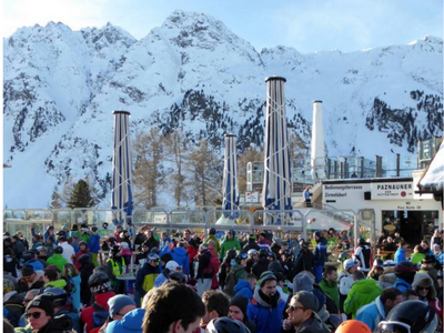 Vibrant après-ski party in Ischgl, Austria, known for its legendary nightlife and energetic crowd.