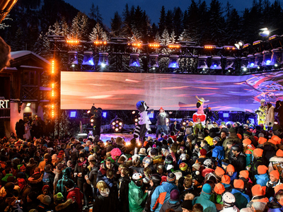 Après-ski celebration in St. Anton, Austria, with skiers dancing and enjoying drinks at a famous mountain bar.