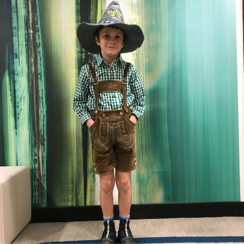 Child in full lederhosen outfit at Oktoberfest in Munich