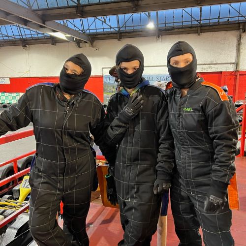 Family wearing go kart suits at JDR Karting in Gloucester during a New Year’s trip.