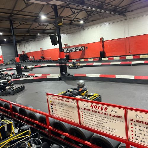 Indoor go karting track at JDR Karting in Gloucester with karts racing during a winter visit.