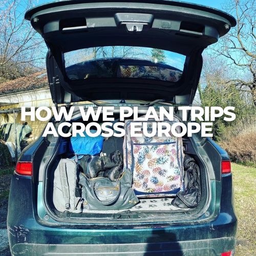 Open car trunk packed with suitcases and bags for a road trip across Europe