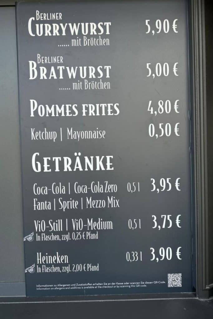 The menu board at Berliner Wurst in Phantasialand showing Berliner Currywurst at 5,90 euro and Bratwurst at 5,00 euro