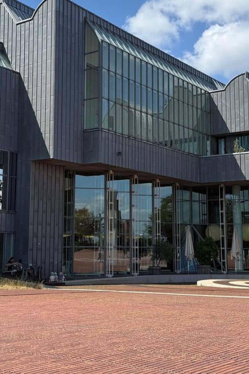 The distinctive scalloped grey roofline of Museum Ludwig, one of Europe's great modern art museums, on a sunny day in Cologne Germany