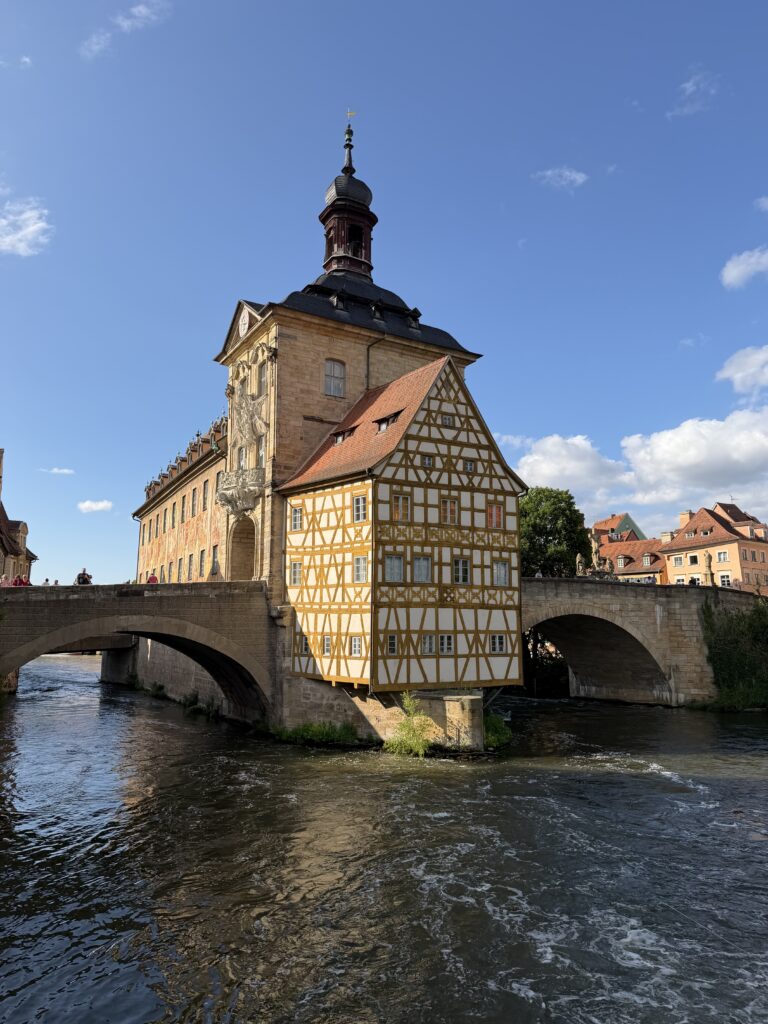 Bamberg’s Altes Rathaus on an island in the Regnitz River with its painted façade and half-timbered upper floor