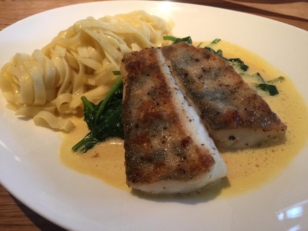 Fish with pasta, spinach and creamy sauce at Eckerts Wirtshaus und Esszimmer in Bamberg