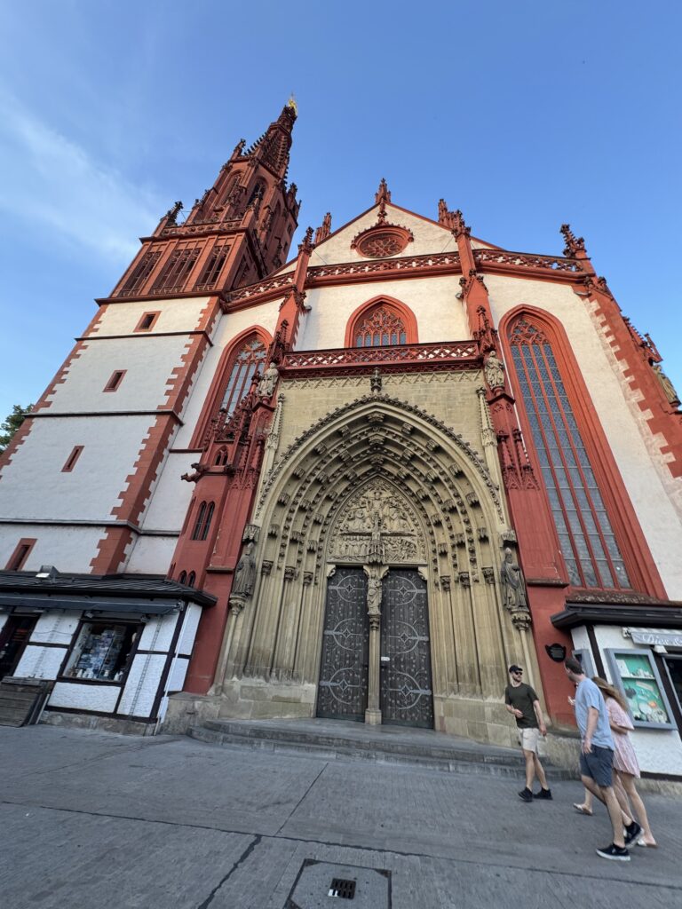 Red-and-white Gothic façade of Marienkapelle in Würzburg, Germany