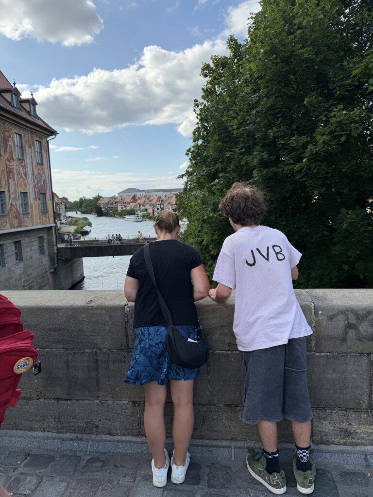 Lisa and Dylan looking over the Regnitz River from a bridge in Bamberg