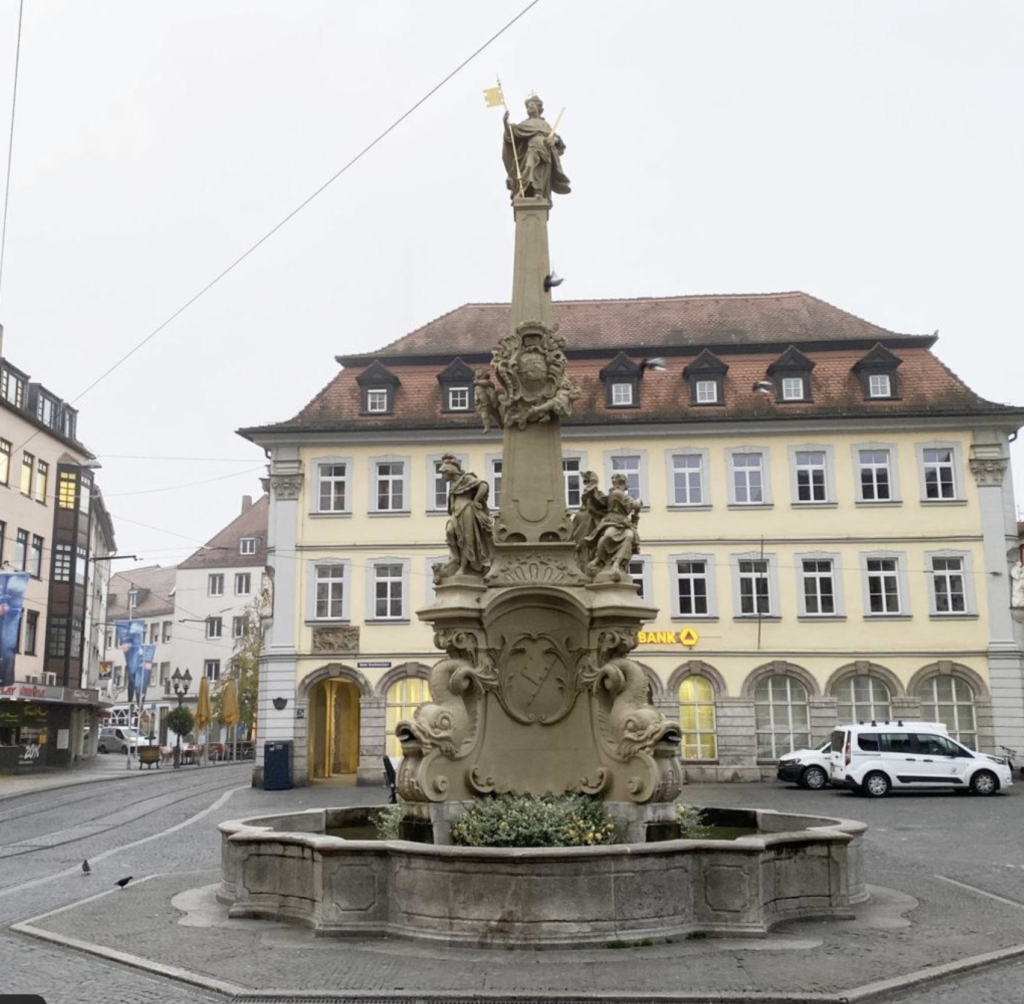 Vierröhrenbrunnen fountain near Würzburg Town Hall in the historic city center