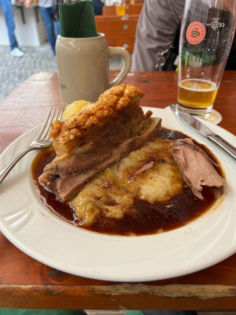 Roast pork with crispy skin, potato dumpling and gravy at Zum Sternla in Bamberg