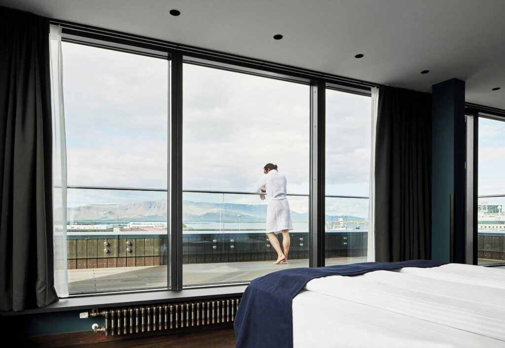 Guest room at Exeter Hotel in Reykjavik with views toward the harbor and mountains