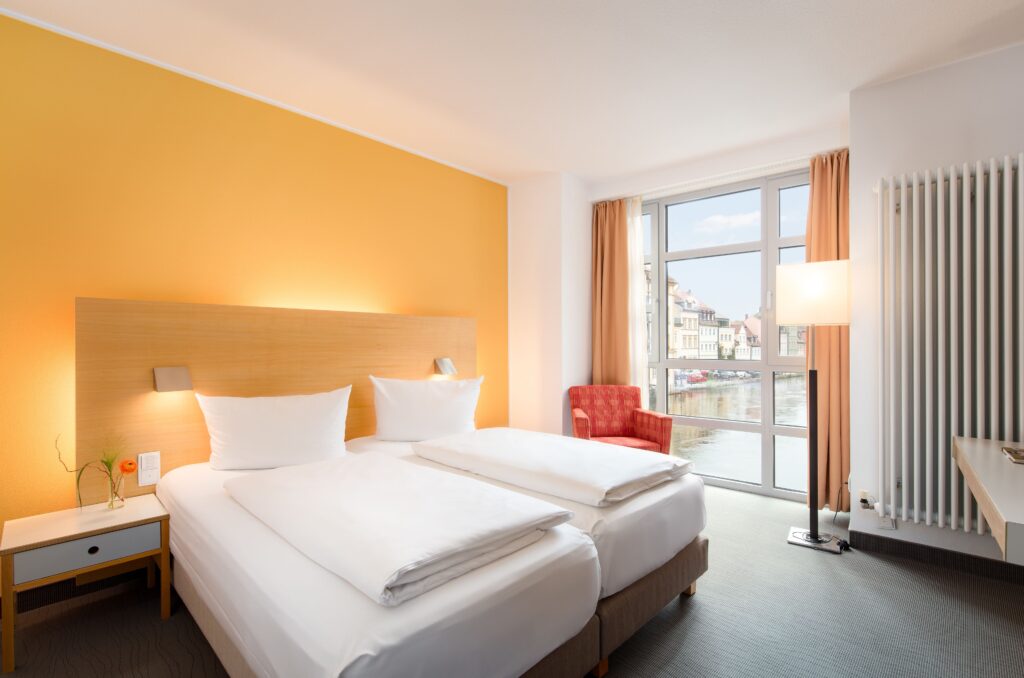 Guest room at Hotel Nepomuk in Bamberg with views over the river
