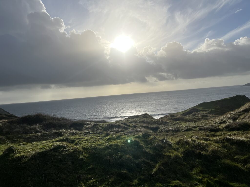View across the green hills and coastline of the Gower Peninsula in South Wales