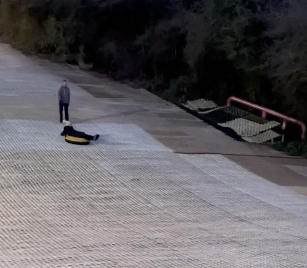 Tubing down the dry slope at Cardiff Ski and Snowboard Centre in Wales