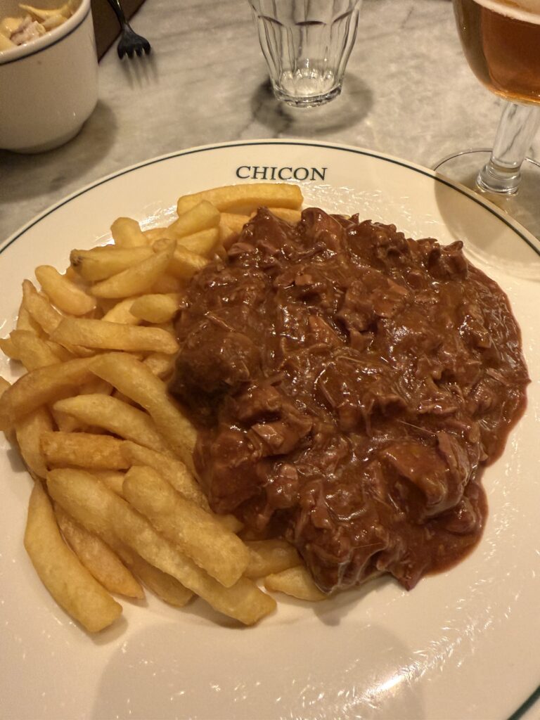 Traditional Belgian stoofvlees served with fries at Chicon restaurant in Antwerp