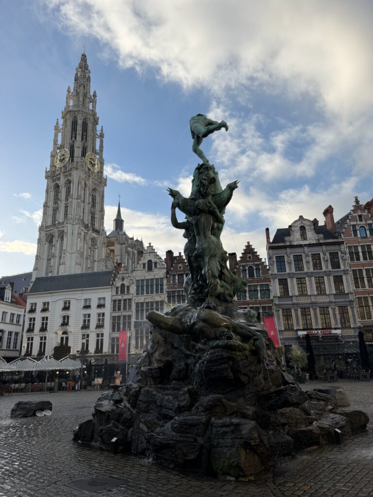 Brabo Fountain in Grote Markt with the Cathedral of Our Lady rising behind it