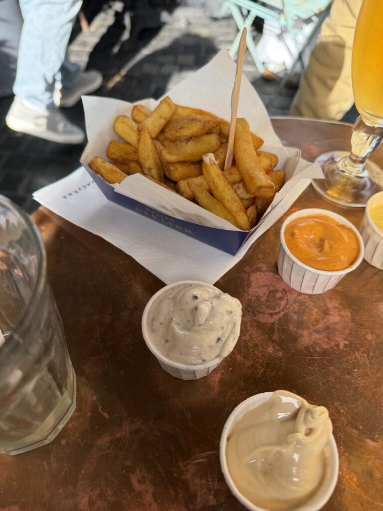 Belgian fries with dipping sauces at Frites Atelier in Antwerp