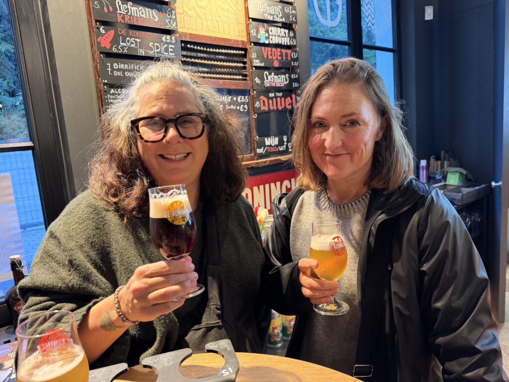 Erin and Lisa enjoying drinks during their visit to De Koninck Brewery in Antwerp