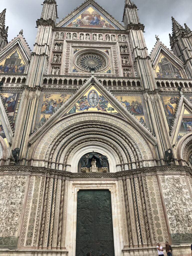 Ornate mosaic facade of Orvieto Cathedral in Umbria