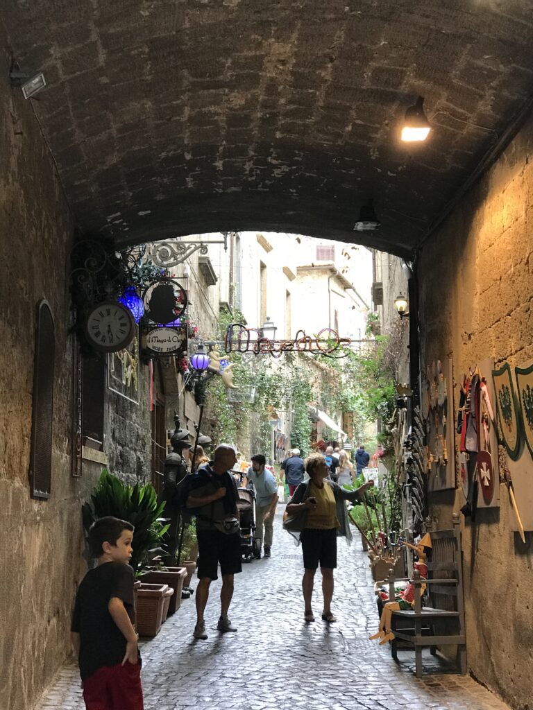 Stone passage leading into a narrow street in Orvieto
