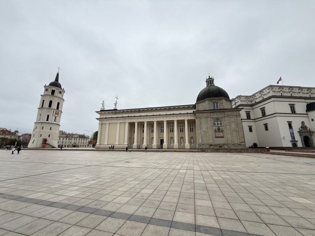 Vilnius Cathedral and its freestanding bell tower overlooking the large historic Cathedral Square