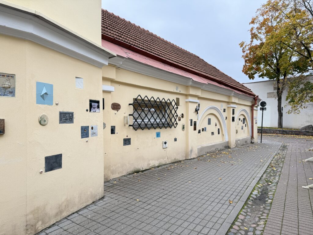 Literatų Street in Vilnius with small artworks and plaques mounted along the walls in honor of writers