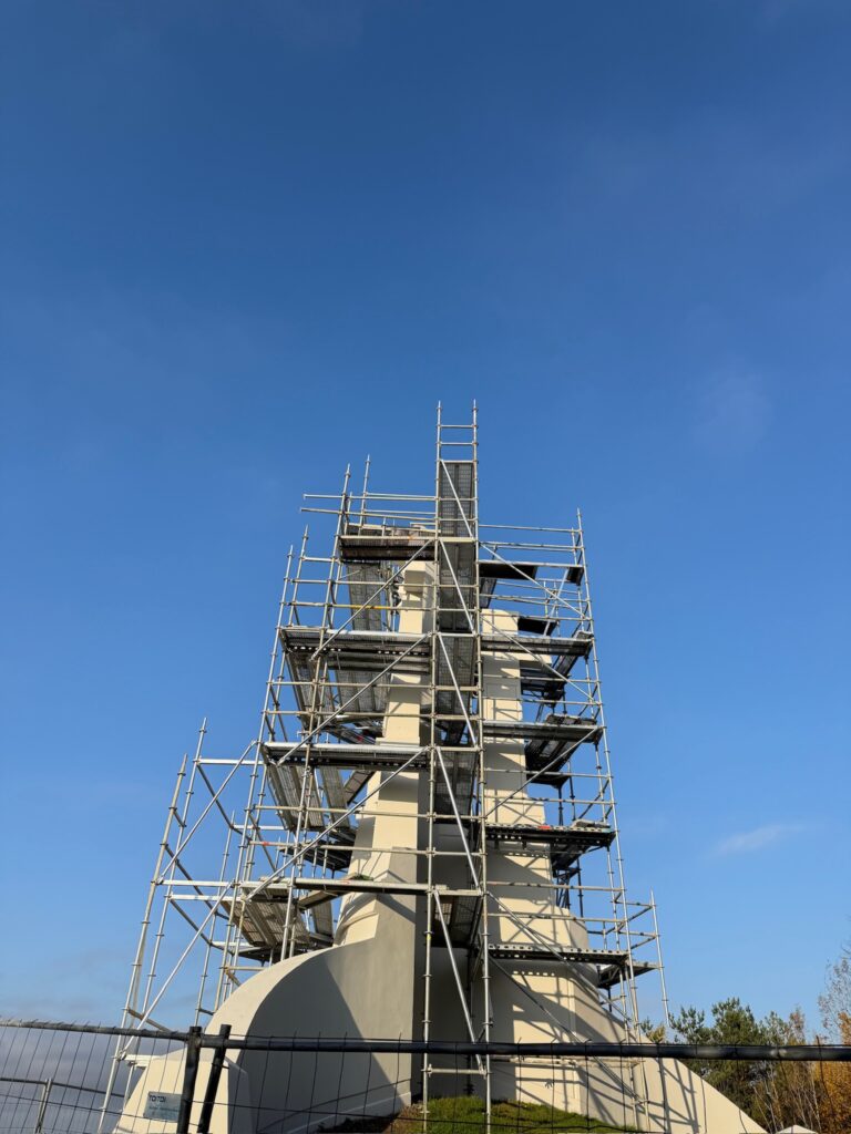 Three Crosses monument on a hill in Vilnius covered in scaffolding during restoration work