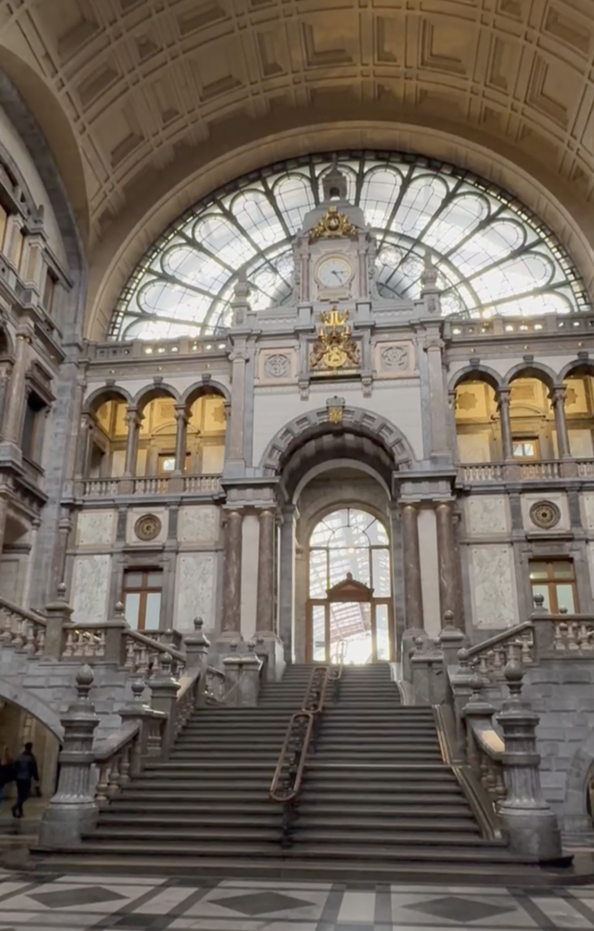 Grand staircase and ornate architecture inside Antwerp Central Station