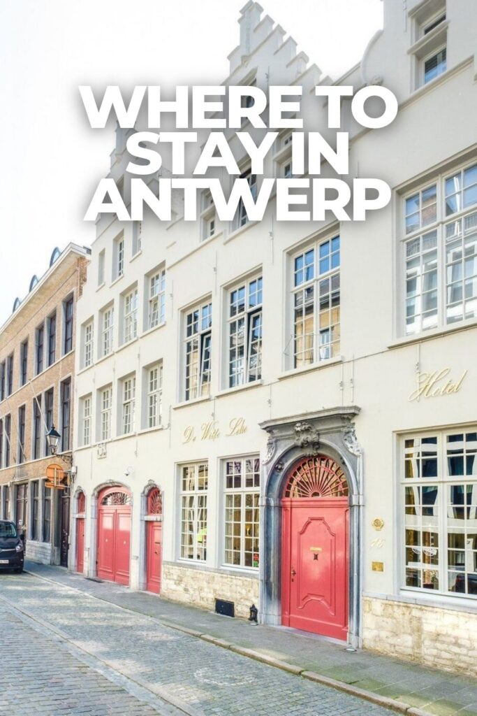 Exterior of De Witte Lelie boutique hotel on Keizerstraat in Antwerp, Belgium, with its distinctive pink doors.