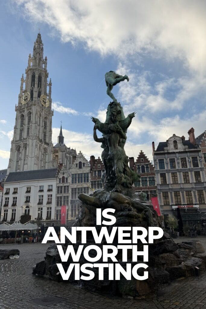 Brabo Fountain in Antwerp's Grote Markt with the Cathedral of Our Lady and historic buildings in the background.