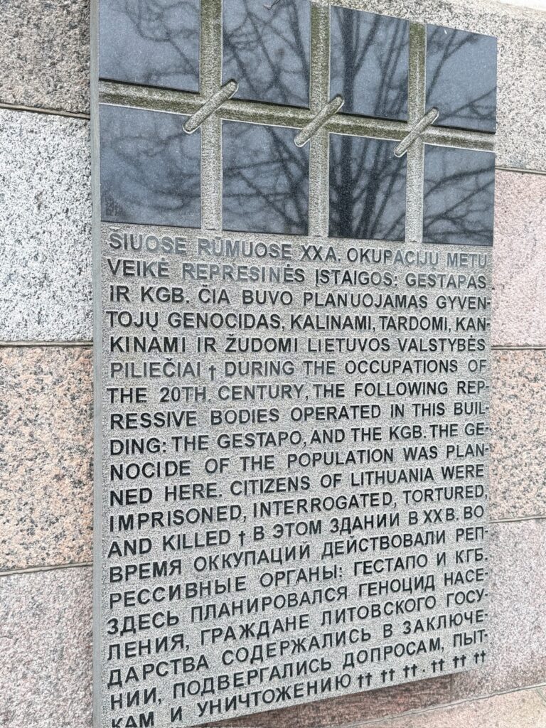 Memorial plaque outside the former KGB headquarters in Vilnius describing the imprisonment and persecution of Lithuanian citizens