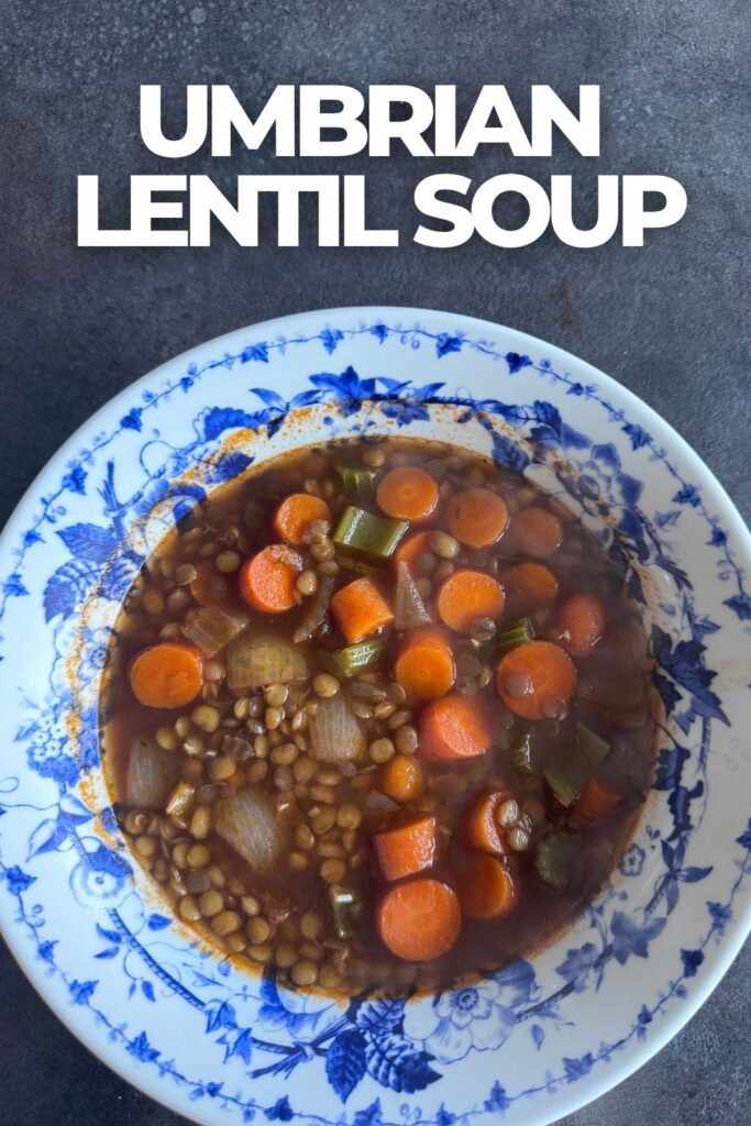 Umbrian lentil soup with lentils, carrots, celery and onion in a blue and white bowl