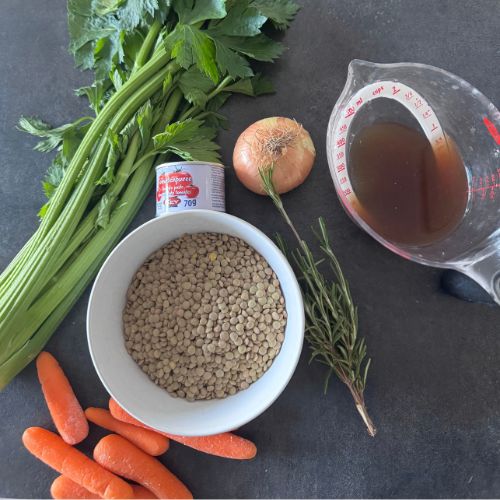 Ingredients for Umbrian lentil soup including lentils, carrots, celery, onion, rosemary, tomato paste and stock