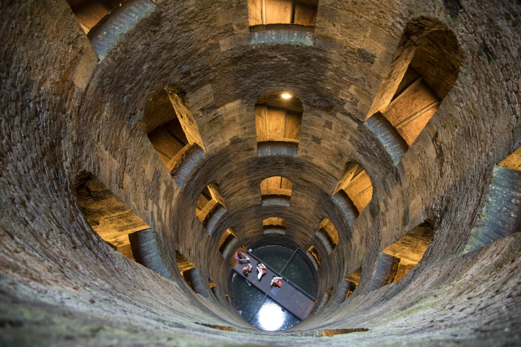 Looking down inside St. Patrick’s Well in Orvieto with its spiral walkways and windows