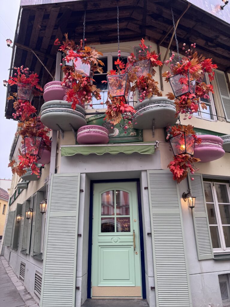 Ponių Laimė café on Stiklių Street in Vilnius decorated with giant macarons and red autumn leaves