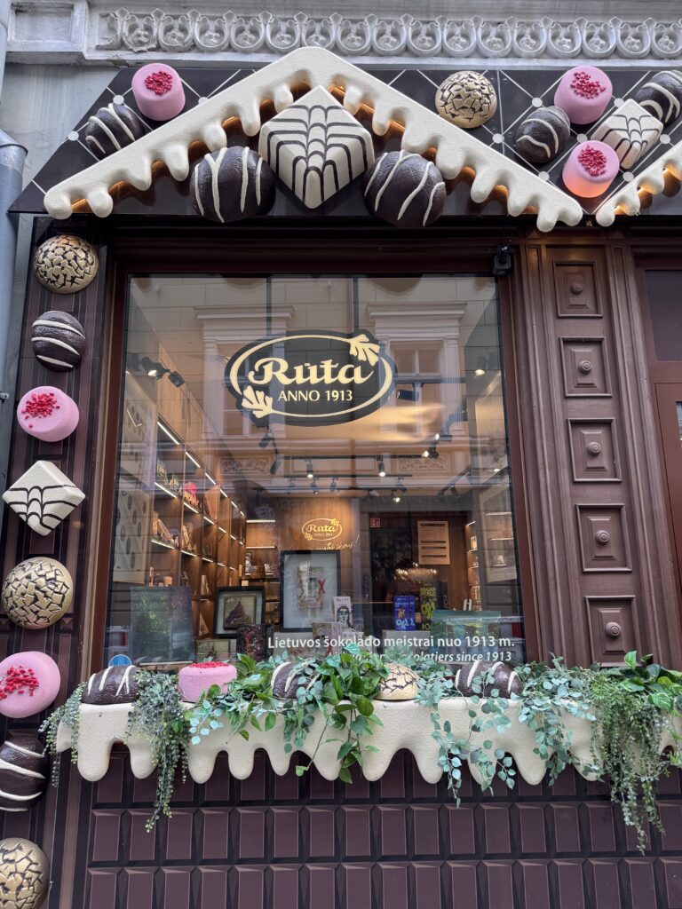 Rūta chocolate shop window in Vilnius Old Town decorated with giant chocolates and white chocolate drips
